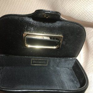 Black clutch with button opening and inside mirror